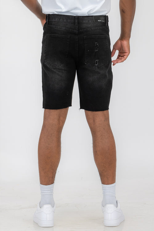 Pantaloncini in denim effetto consumato da uomo