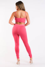 Completo sportivo casual con top a maniche corte e leggings a contrasto in rete FUCSIA