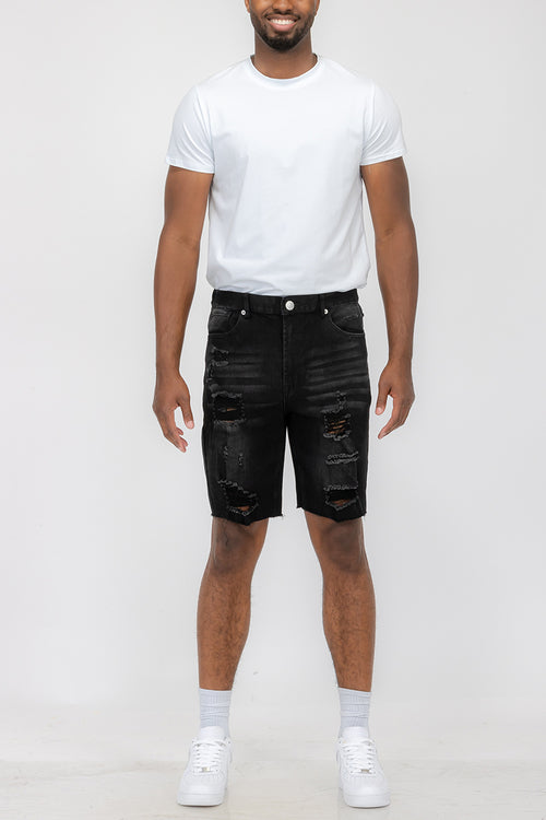 Pantaloncini in denim effetto consumato da uomo